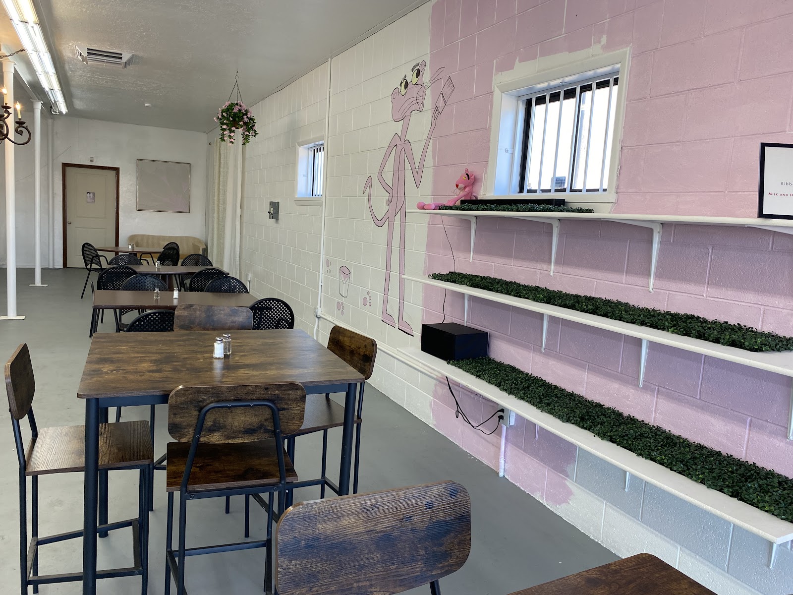 Tables and chairs inside the Milk and Honey Coffee cafe