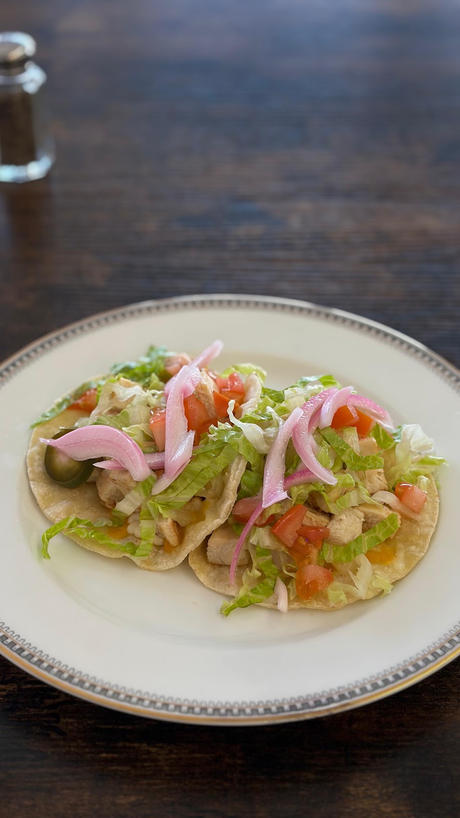 Two tacos on a plate at Milk and Honey Coffee